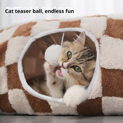 Tabby kitten batting the teaser ball inside the Purrloom 2-in-1 cat tunnel bed in coffee checkerboard